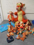A tray of assorted Winnie-the -Pooh Tigger toys together with a large Tigger