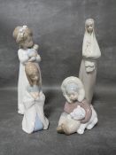 Two small Lladro figurines together with two other figurines (4)