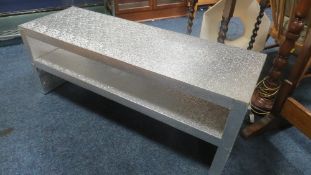 Two modern two tier tables in silver, with embossed finish, both boxed (Unchecked)