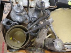 A tray of assorted metal ware to include silver banded cutlery, two brass cooking pans etc