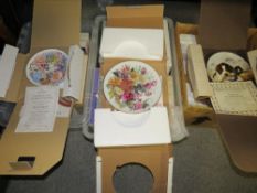 Three trays of assorted collectors plates