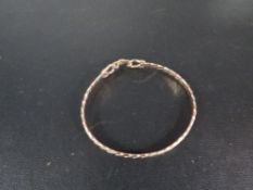 A hallmarked 9 carat gold three colour spring clasp bangle approx weight 8.5g