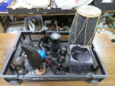 A tray of assorted tribal carvings, drum etc