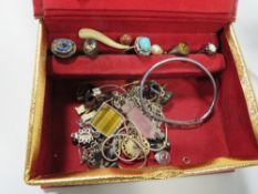 A jewellery box and contents to include rings, necklaces etc