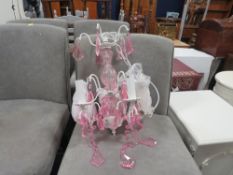 A small modern pink chandelier with box- ex shop stock, may have damage
