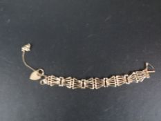 A hallmarked 9 carat gold gate bracelet approx weight 17.1g