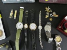 A quantity of collectables to include wristwatches, silver coin etc