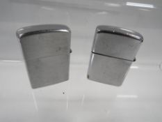 A vintage USS Monticello markman zippo petrol lighter together with a Philippines konwal type (2)