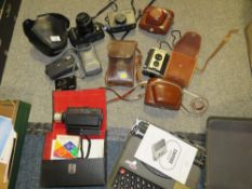 A tray of assorted cameras and binoculars to include a Minolta example