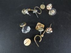 An assortment of yellow metal earrings etc