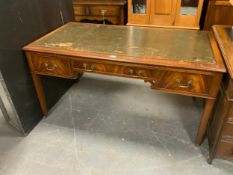 A reproduction mahogany leather top desk. A/F