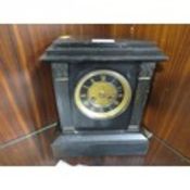 A vintage slate mantle clock