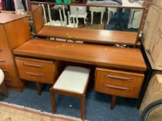 A mid-century teak G-plan dressing table with matched stool