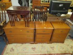 Two Stag three-drawer bedsides, together with a matching chest of three drawers and a nest of tables