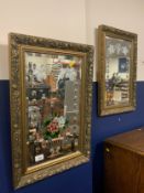 A pair of gilt framed painted mirrors