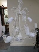 A modern two branch chandelier in box- ex shop stock, may have damage