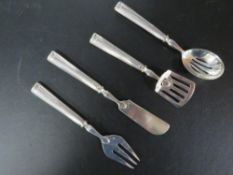 An antique white metal 4 piece serving cutlery set