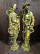 A pair of resin Asian figures