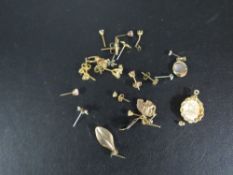A collection of assorted yellow metal earrings