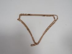 An unmarked yellow metal watch chain