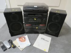 A vintage Sony stereo system and speakers to include a five disk CD player