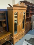 An Edwardian mirrored wardrobe