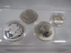Various silver coins, consisting of silver 1oz Britannia's, 2002, a 1995 United Nations 2 pounds and