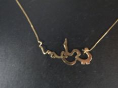 A Middle Eastern style pendant stamped 750 on chain approx weight 5.2g