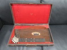 An Anton Bauer of Linz Zither in a fitted case - case A/F