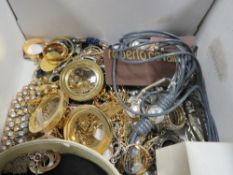 A shoebox of assorted costume jewellery