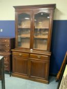 An antique mahogany glazed floor standing bookcase