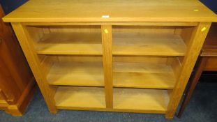 A modern oak double fronted wide, low bookshelf