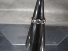 A yellow metal dress ring stamped 9ct and set with CZ's approx weight 3g