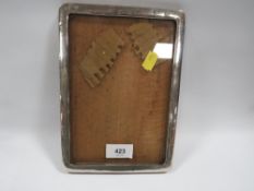 A hallmarked silver photo frame