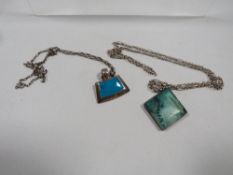 A Mexican silver pendant on chain with another