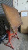 A vintage cast iron technical drawing board