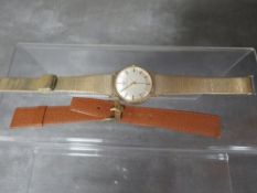 A vintage Girard-Perregaux wristwatch in original box with addition leather strap and warranty