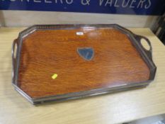 An Edwardian style silver plated twin handled gallery serving tray with wooden interior having