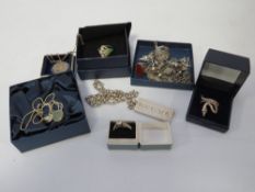 An assorted of silver and white metal jewellery to include an ingot