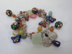 An Oriental silver charm bracelet