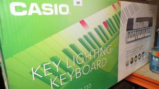 A boxed Casio keyboard LK110 (Unchecked)