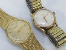A vintage gold record wristwatch on expandable steel bracelet together with a Regency example