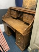 An antique oak roll-top desk