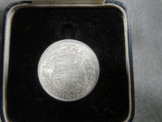 A George V 1918 silver half crown in period fitted case by R.F. Beard ltd of Cheltenham