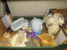 A tray of assorted ceramics and glassware to include a glass lamp and a ceramic model of a poodle