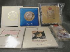 A quantity of Royal mint uncirculated packs £5 pounds, date set etc