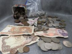 A collection of vintage coins and notes