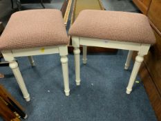 A pair of modern upholstered stools