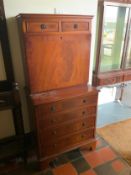 A small reproduction mahogany cabinet/chest. S/D