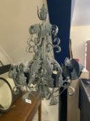 A modern green metal chandelier